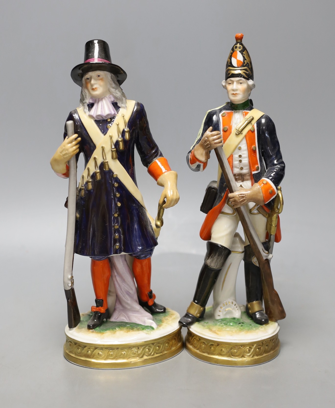 A pair of Continental porcelain military figures - tallest 25cm